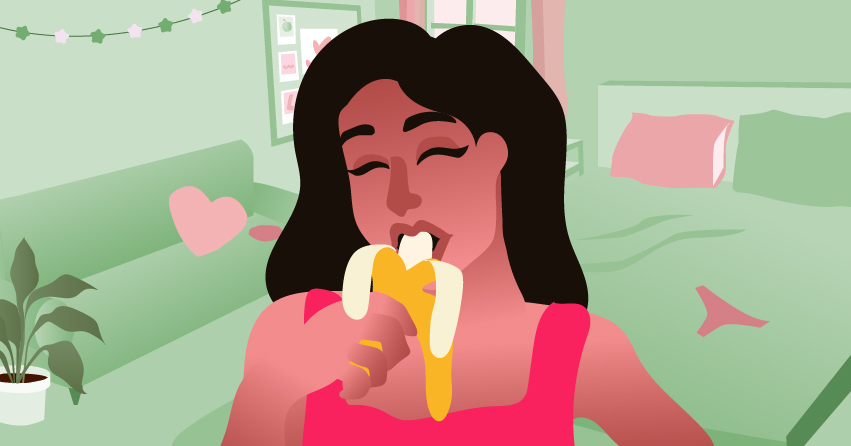 A woman eating a banana in a sexy manner. 