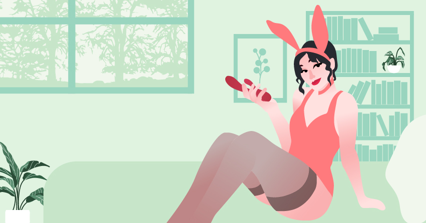 A woman in a bunny costume holding a rabbit vibrator. 