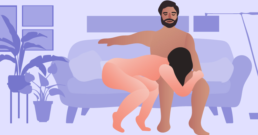 A naked woman giving a blowjob to her naked partner while they're sitting in a sofa. 