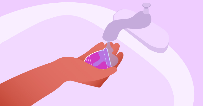 A person washing a menstrual cup in the sink. 