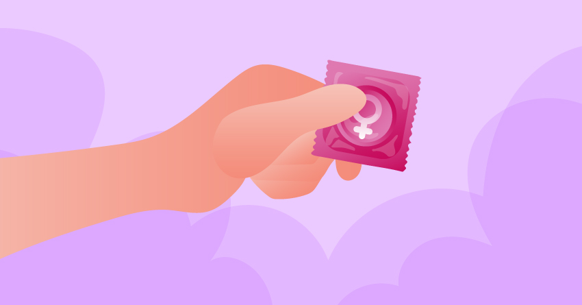 A hand holding a female condom. 