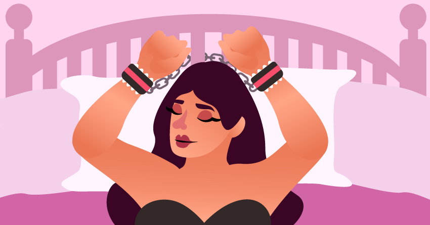 A woman chained in her bedroom with kinky BDSM cuffs. 