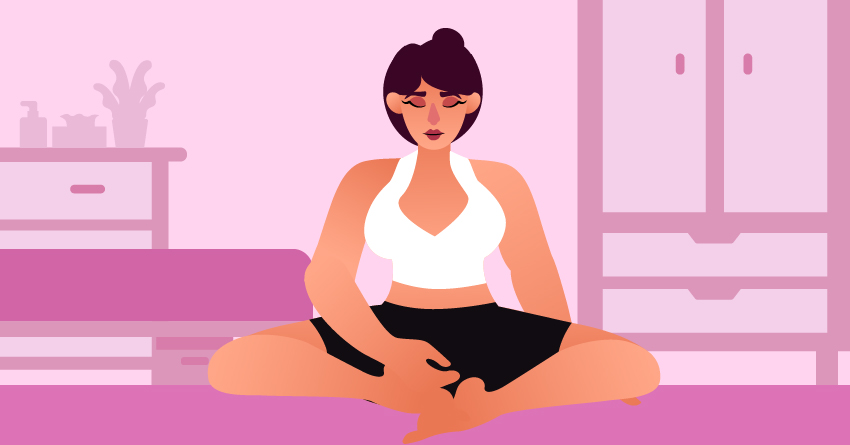 A woman meditating in her bedroom. 