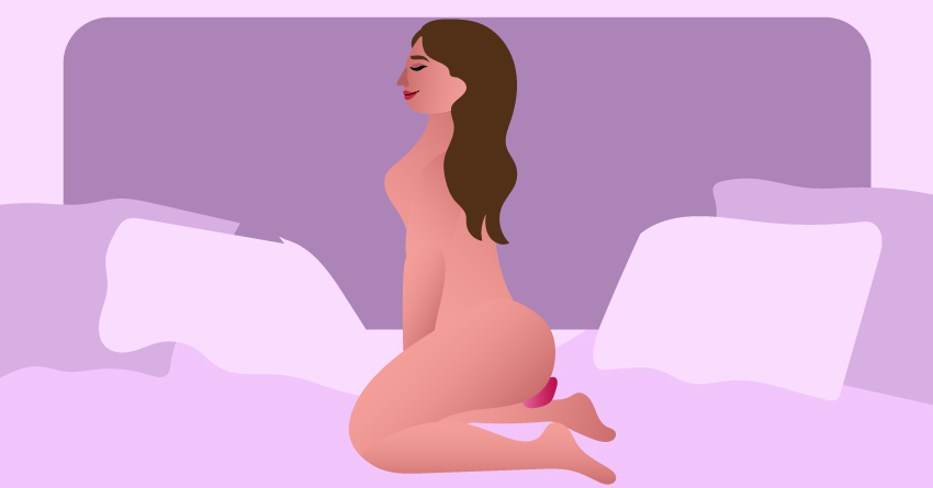 A woman masturbating using different sex toys. 