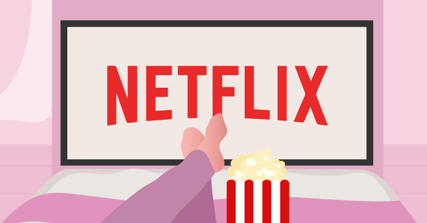 A person lying in their bed, watching netflix. 