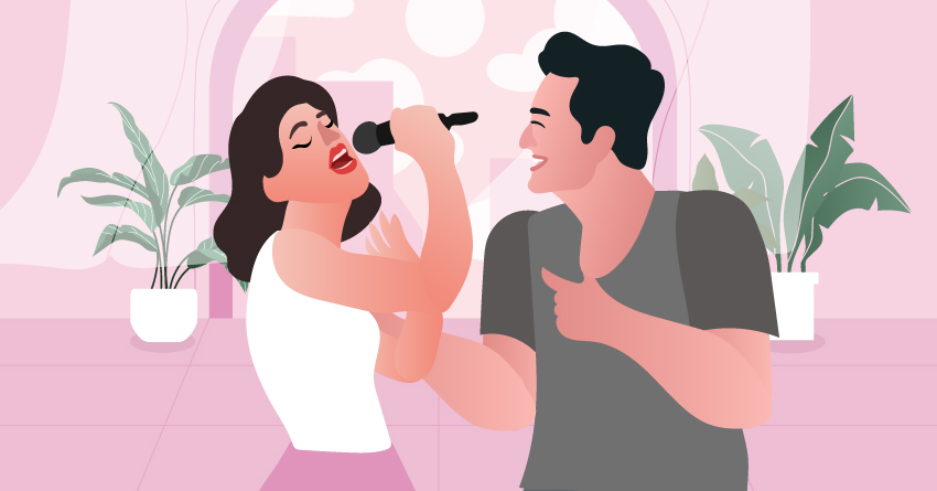 A couple having karaoke night at home. 