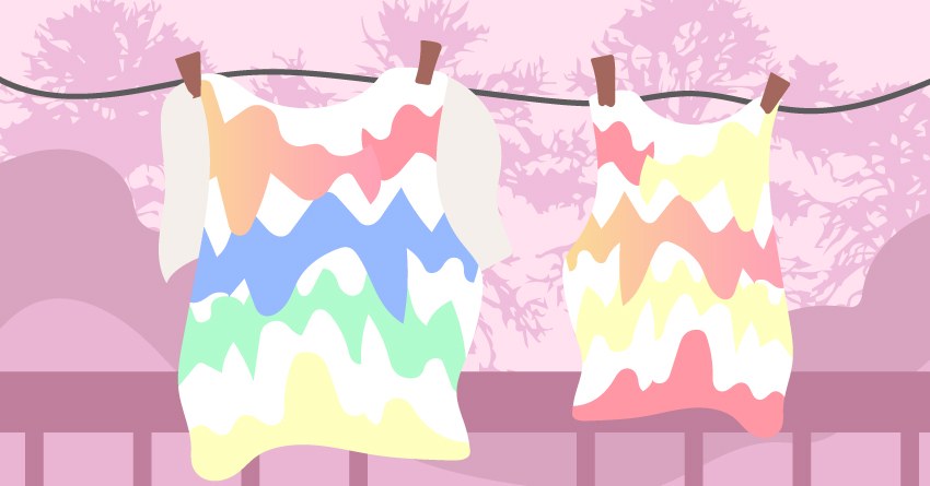 Tie-dye shirts hanged outside. 