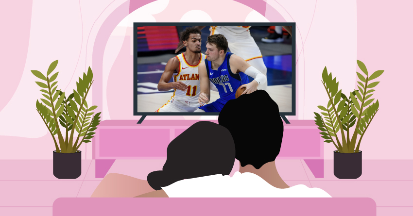 A couple watching a basketball game at home. 