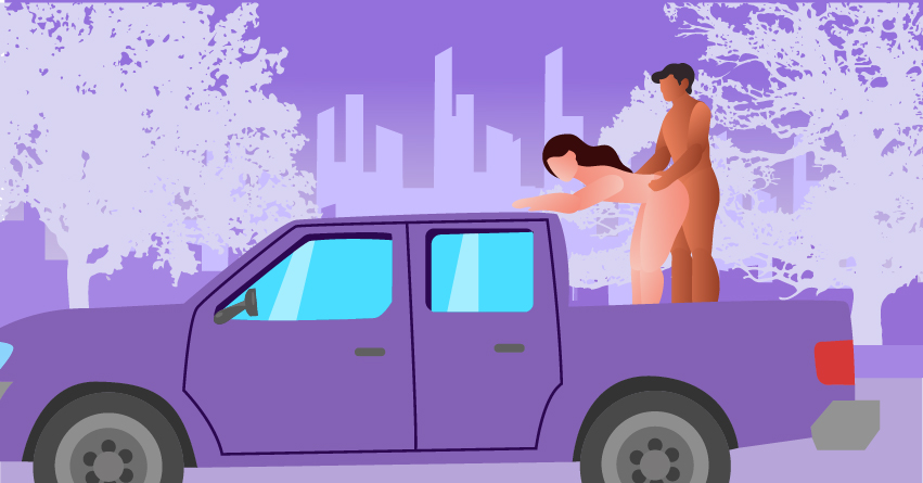 A couple having outdoor sex in the back of a pickup truck. 