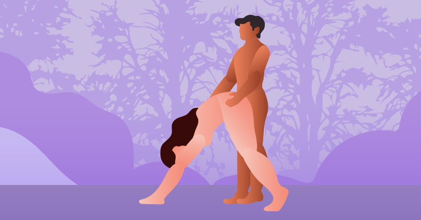 A couple having outdoor sex in the woods. 