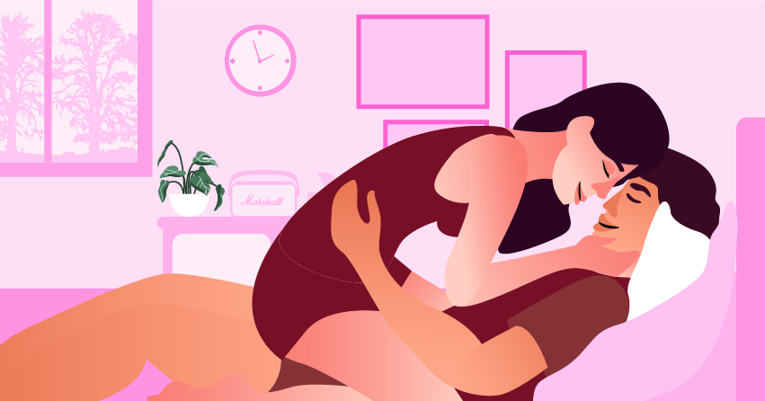 A woman on top of her boyfriend, cuddling with him. 