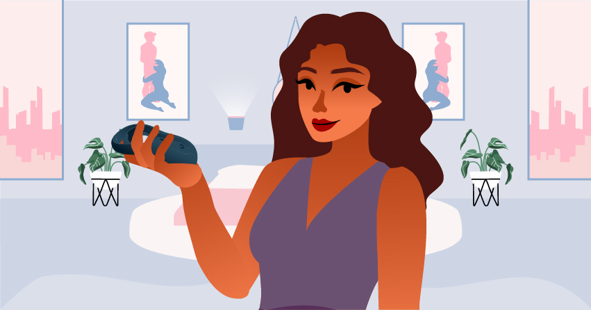 A woman holding a cock ring. 