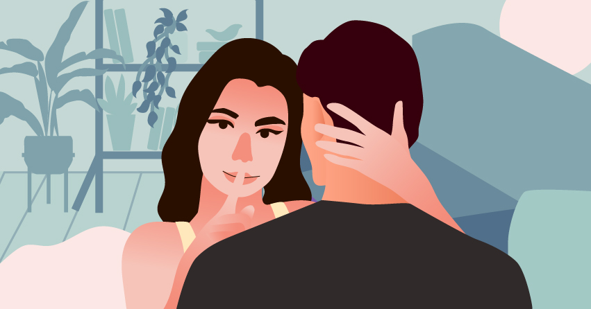 A woman wrapping her arms in her boyfriend's nape, making the "ssshhh" sign. 