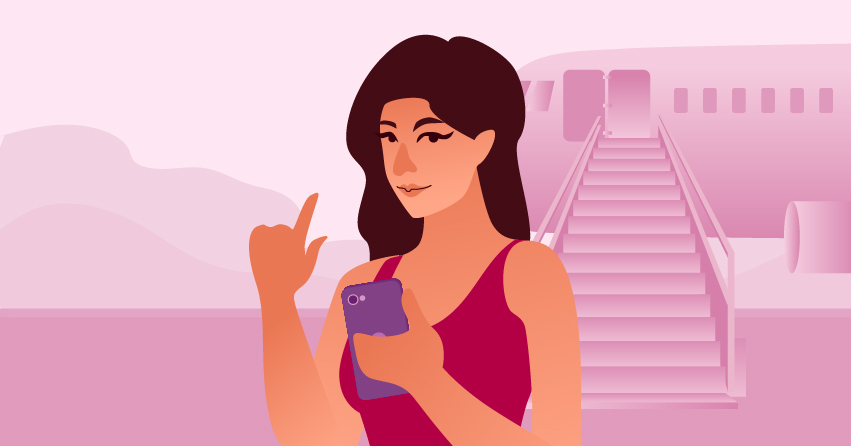 A woman checking her phone and smiling in a naughty way. 