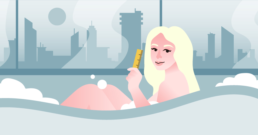 A woman sitting in a bathtub, holding a ruler. 