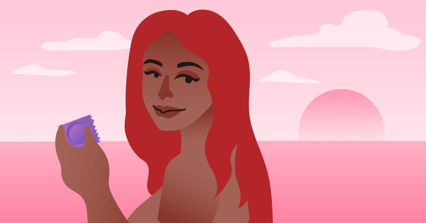 A woman holding a condom. 