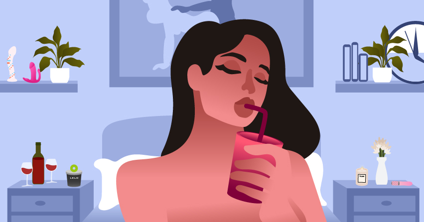 A woman sensually sipping a drink. 