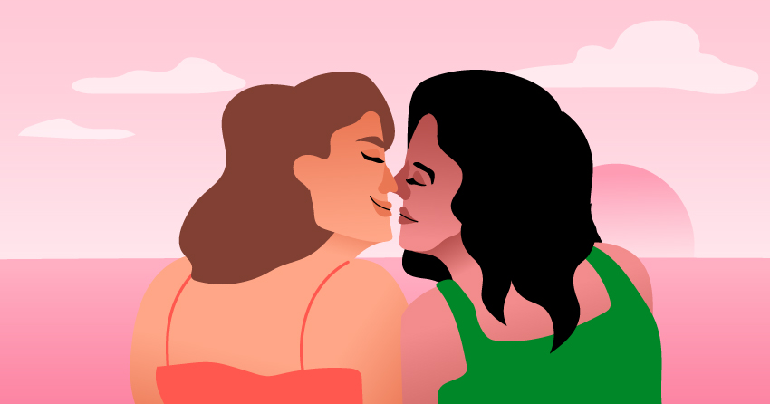 Two women having an eskimo kiss. 
