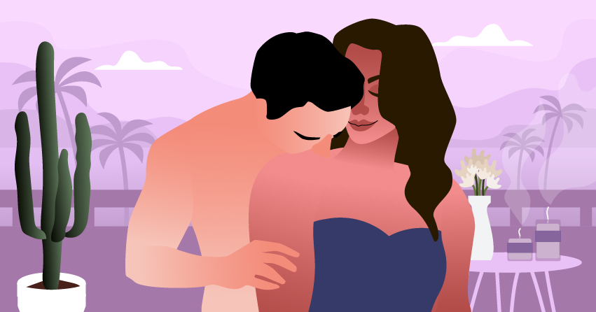 A man sensually kissing his girlfriend's shoulder. 