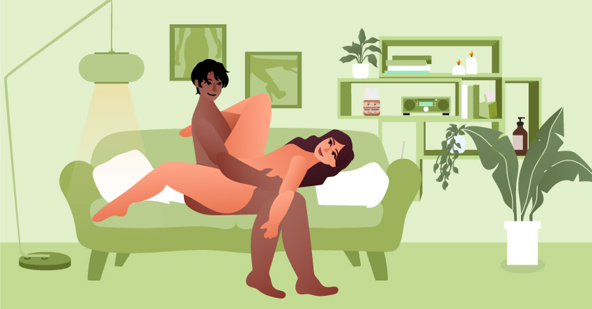 A couple having sex in the couch. 
