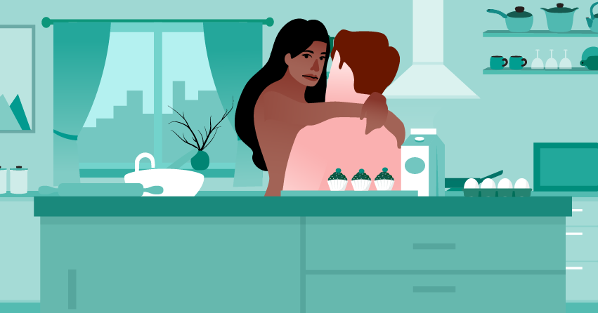 A couple having sex in the kitchen. 