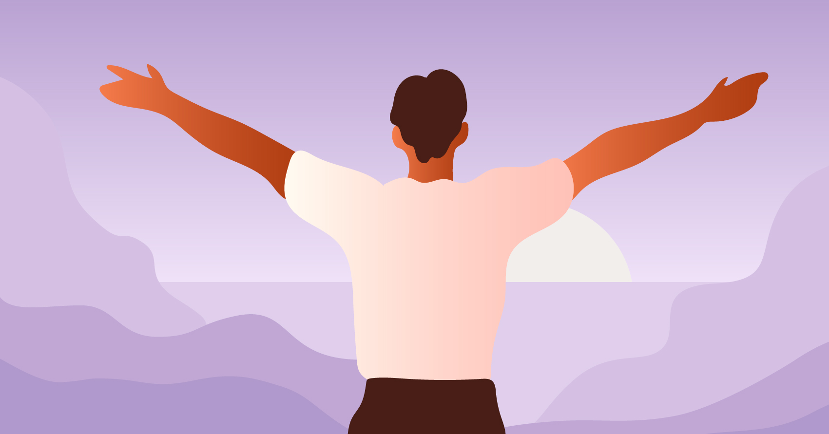 A man spreading out his arms while watching the sunrise.