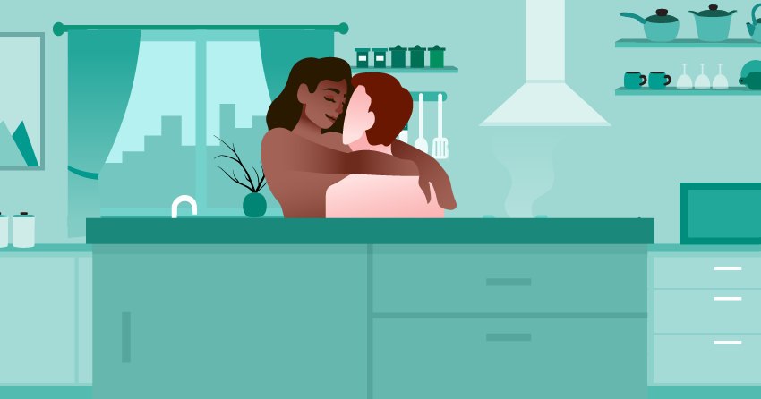 A couple having sex in the kitchen. 