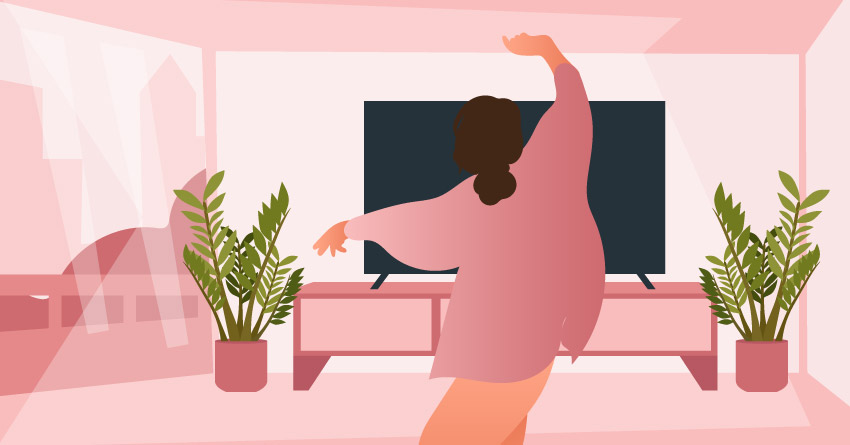 A woman dancing in the apartment alone. 